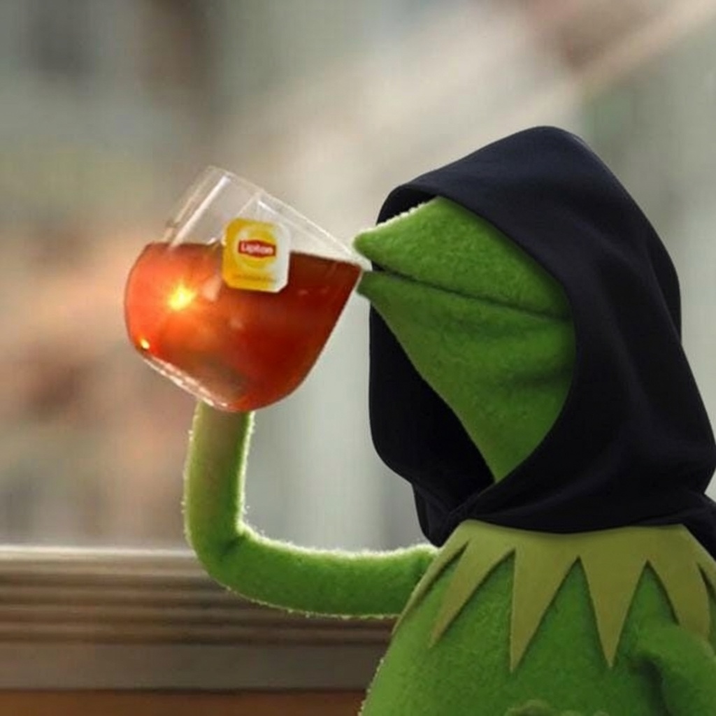 Hooded Kermit sipping tea